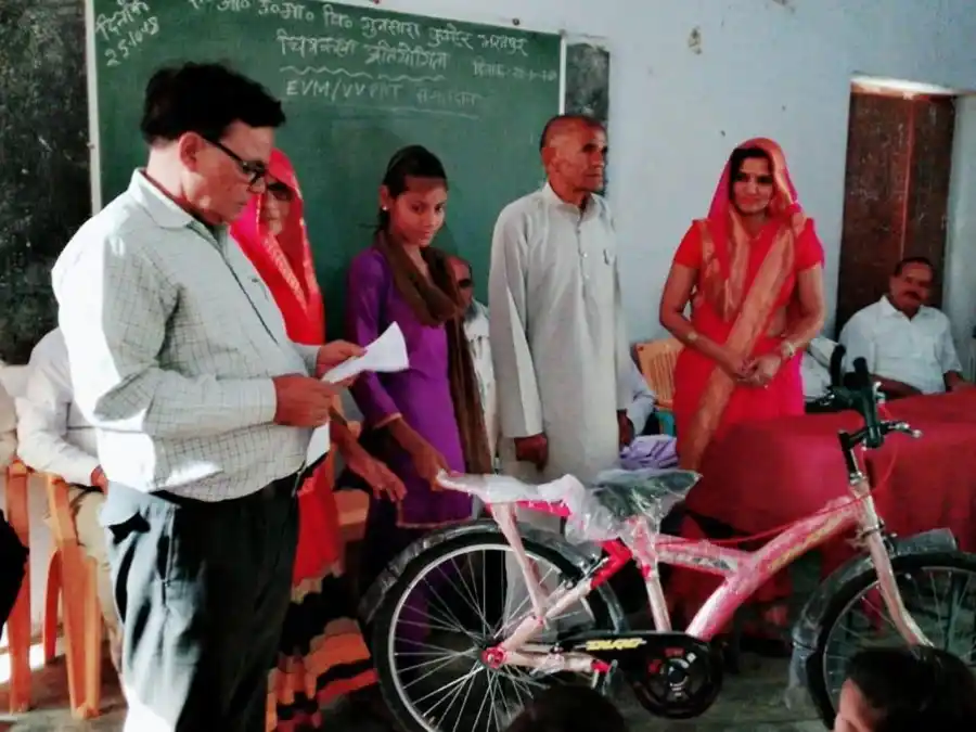Bicycle presented to a schoolgirl at an SKL bicycle distribution event